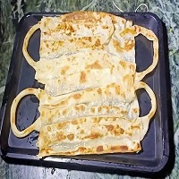 رستوران هندی و پخت نان به شکل ماسک